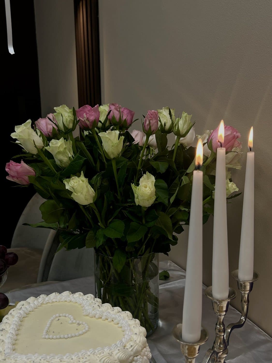 Celebration cake with roses and candles